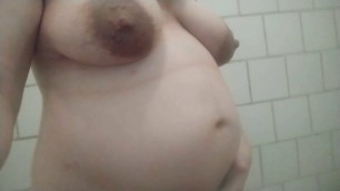 8-months pregnant teen with huge boobs in public shower