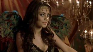 Mila Kunis shows cleavage